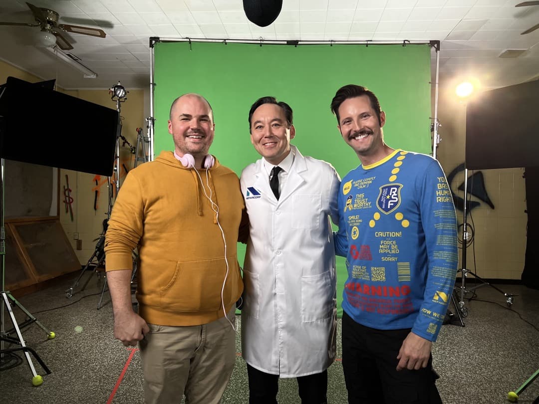 Behind the scenes photo 8 from Clone Cops production showing danny dones, steve byrne, and phillip cordell on set for the training video scenes